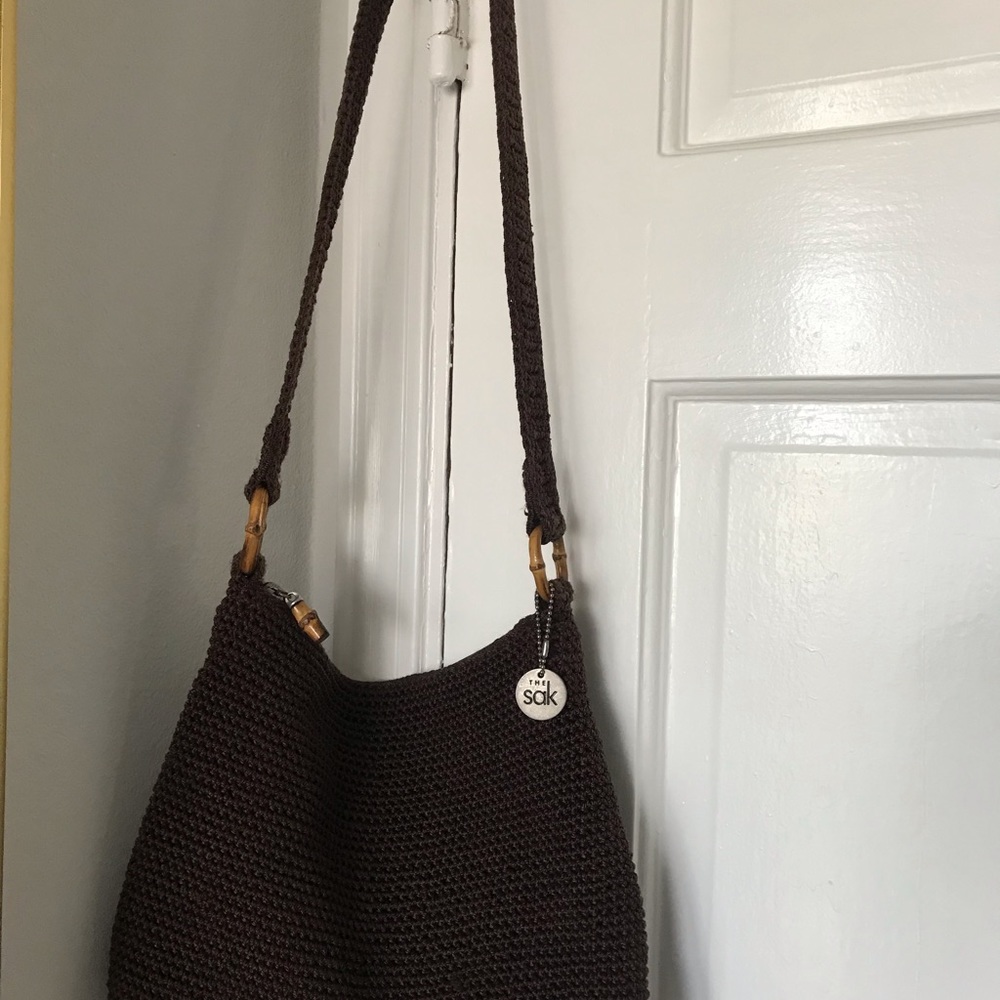 The SAK brown woven bag with bamboo accent